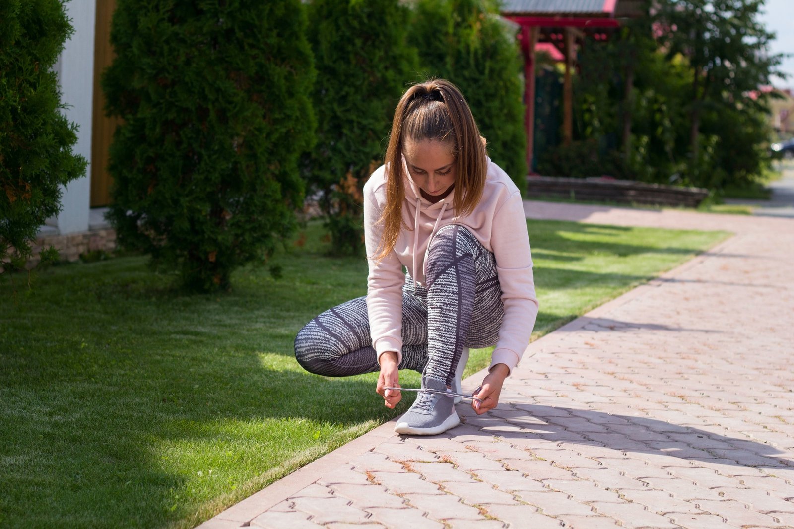 Young sporty woman getting ready to start running workout